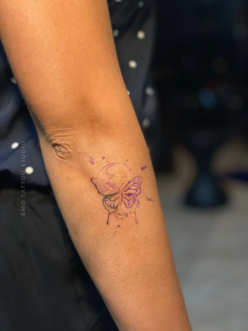 Delicate monarch butterfly fine line tattoo