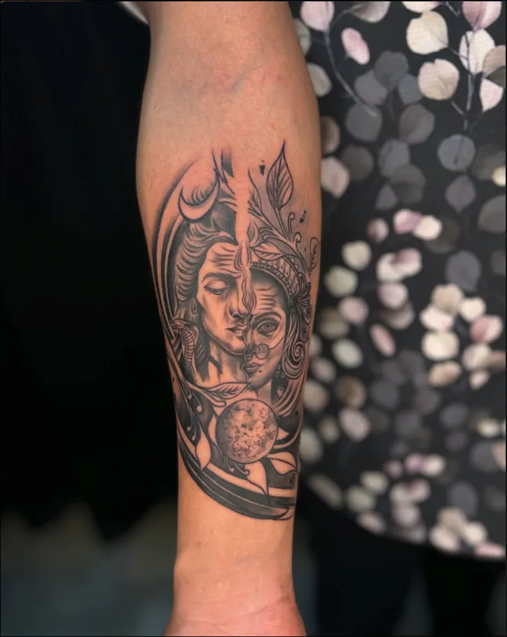 Shiva and Shakti split face with crescent moon tattoo